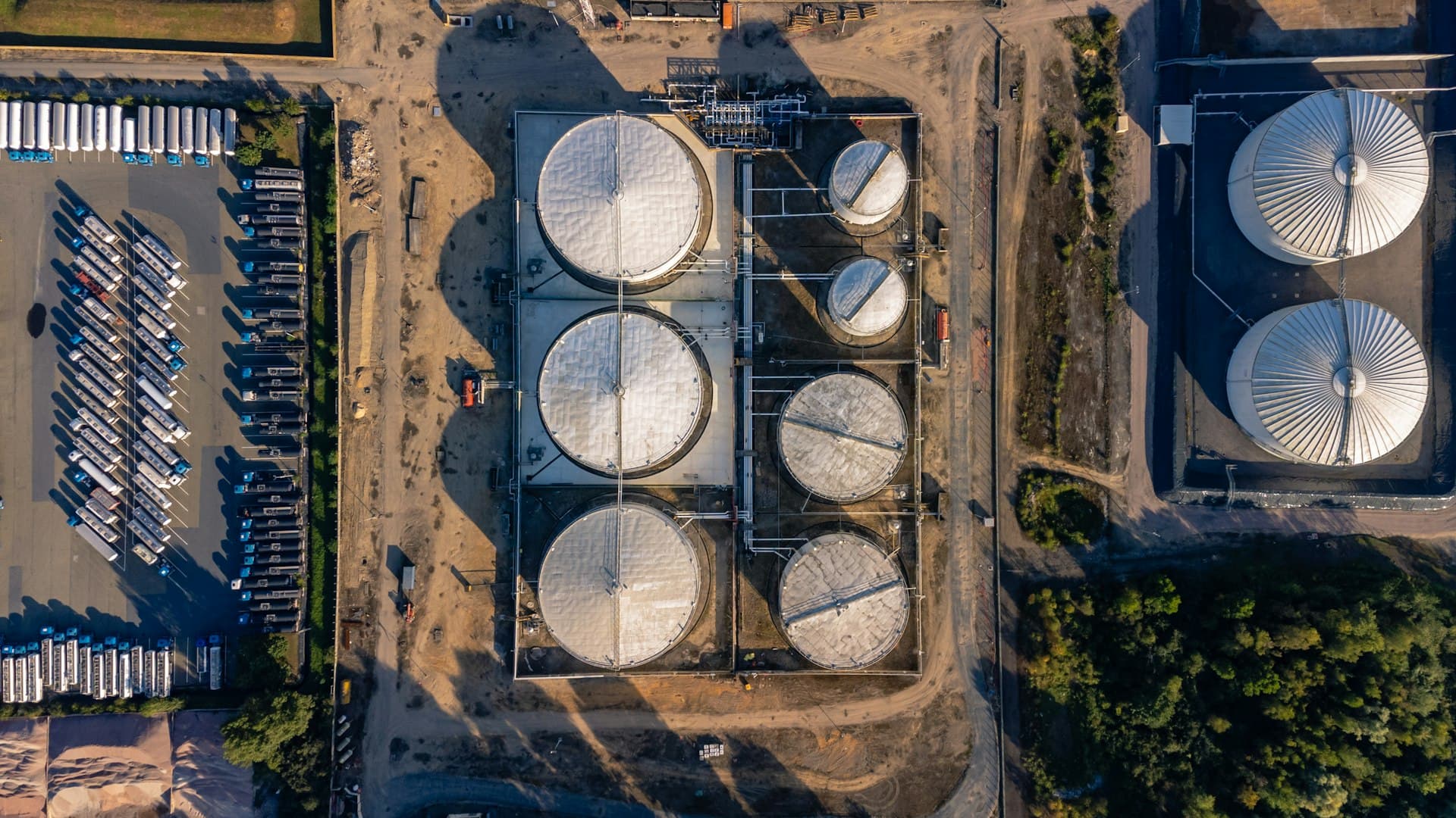 Aerial view of an oil refinery complex with storage tanks